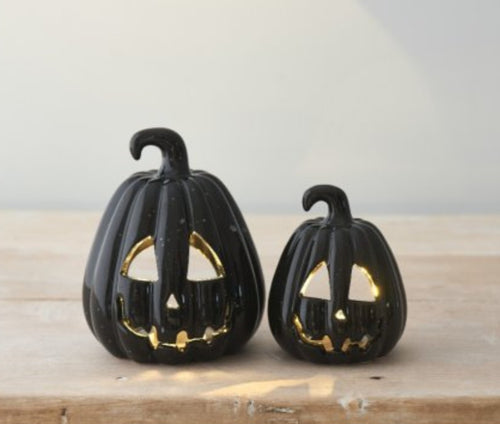 Carved Black Pumpkin Lanterns