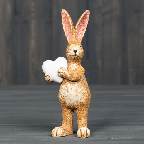 Standing Rabbit holding white heart