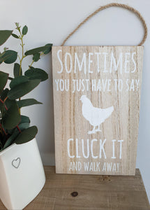 "Cluck it ...." natural wooden sign