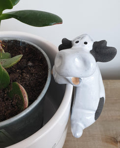 Ceramic sheep or cow pot hugger