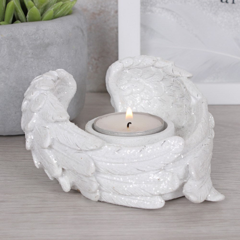 Pair of sparkly angel wings with tea light holder