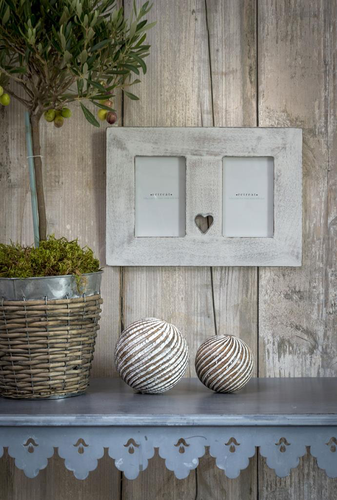 Double distressed white picture frame with heart cut out detail