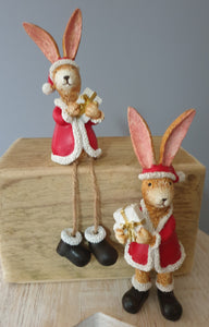 Santa Bunny holding Present
