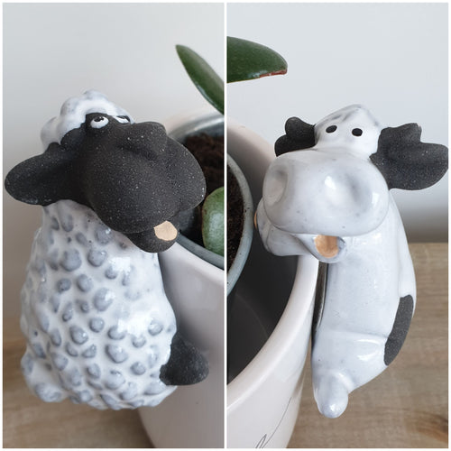 Ceramic sheep or cow pot hugger
