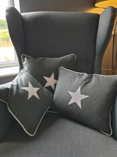 Load image into Gallery viewer, Charcoal grey with white star motif cushions in varying sizes.